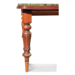 A mechanical extending mahogany table