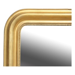 A mirror with carved gilded wood frame