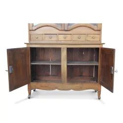 A glazed walnut cabinet, four openings