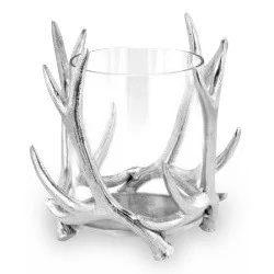 A decorative candle holder in silver metal and glass