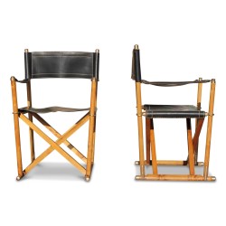 A pair of oak and stitched leather seats