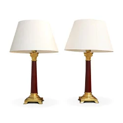 A pair of oxblood column lamps