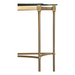 A sofa back in gold metal and glass top