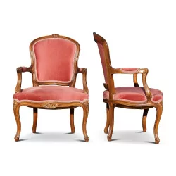 A pair of beech seats covered in pink fabric