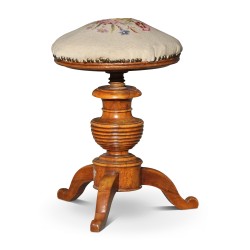 A circular seat in walnut covered with gobelin