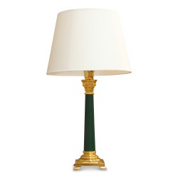 A green column lamp with Corinthian capital.