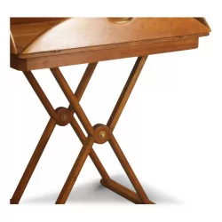 A “Bateau” coffee table in walnut-tinted rubberwood