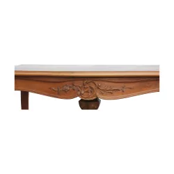 A richly carved walnut writing table