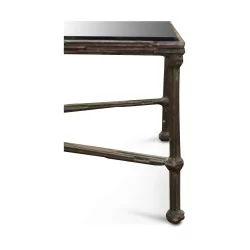 A rectangular bronze table, glass top