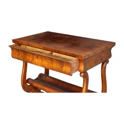 A side table in burl walnut, embossed wood