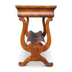 A side table in burl walnut, embossed wood