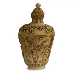 A richly carved ivory bottle