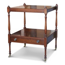 A mahogany bedside table, a drawer, bronze caster feet