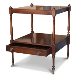 A mahogany bedside table, a drawer, bronze caster feet