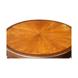 A circular games table in mahogany and veneer wood