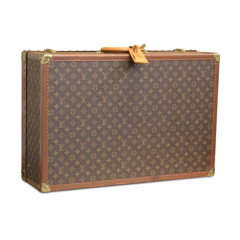 Un bagage "Louis Vuitton" recouvert de cuir imprimé, orné de laiton doré - Moinat - Accessoires de décoration