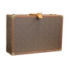 Un bagage "Louis Vuitton" recouvert de cuir imprimé, orné de laiton doré - Moinat - Accessoires de décoration