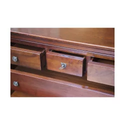 A richly molded walnut storage unit, five drawers