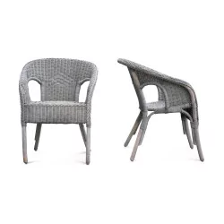 A pair of matte gray rattan seats