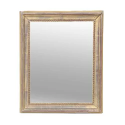 Un miroir avec cadre doré, moulure décor "Perle"