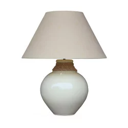 A light yellow porcelain light fixture with yellow shade.