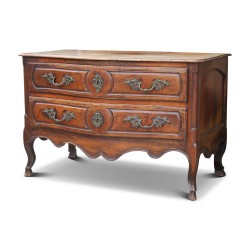 A richly molded and carved walnut storage unit