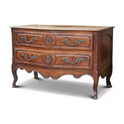 A richly molded and carved walnut storage unit