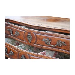 A richly molded and carved walnut storage unit