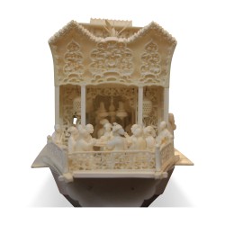An ornately carved ivory boat sculpture