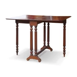A mahogany “Gateleg” table. England