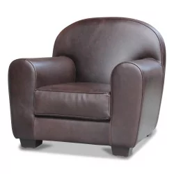 A “Bixter” armchair covered in full-grain “Luxury” leather, dark brown color