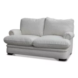 A beige sofa with silver diamond print.