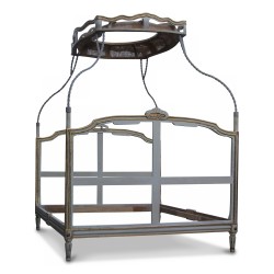 A Louis XV canopy bed in white and gold lacquered beech, richly molded.