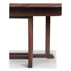 \"Barlow Tyrie\" teak garden table with integrated extension.