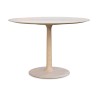 Une table ronde en bois de frêne - Moinat - Tables de salle à manger