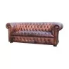 Un canapé "Chesterfield" en cuir, patine marron. Restauré - Moinat - Canapés