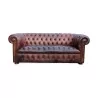 Un canapé "Chesterfield" en cuir, patine marron. Restauré - Moinat - Canapés