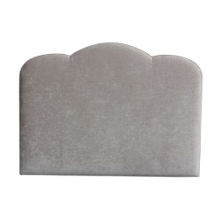 A “Nuage” headboard covered in gray “Sherborne” fabric