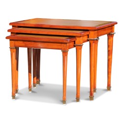 A directorial nesting table in “Mailfert” cherry wood. faceted feet, decorated with bronze