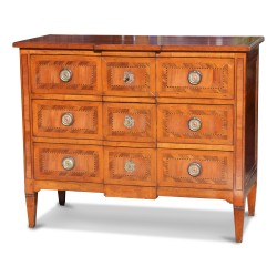 A cherrywood chest of drawers, “Richelieu” model, mounted on oak, three drawers