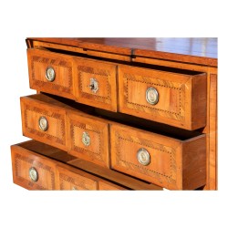 A cherrywood chest of drawers, “Richelieu” model, mounted on oak, three drawers