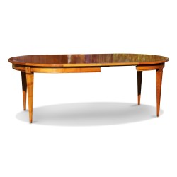 A round directoire table in cherry wood from the \"Richelieu\" collection, doweled with two extensions