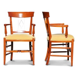 A pair of executive chairs in cherry wood, covered in yellow fabric. French work