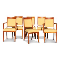 A set including two armchairs and four chairs in cherry wood upholstered with gold yellow fabric