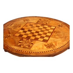 A Louis Philippe table, richly inlaid \"chessboard\" top, tripod foot