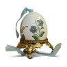 A porcelain egg with floral decoration on a gilded bronze base - Moinat - Decorating accessories
