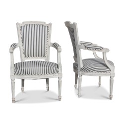 A pair of Louis XVI armchairs in painted wood, conventional upholstery, covered in fabric