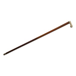 A wooden cane with ivory cross