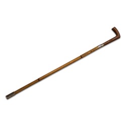 A bamboo cane with wooden cross