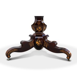 An inlaid walnut dining room table